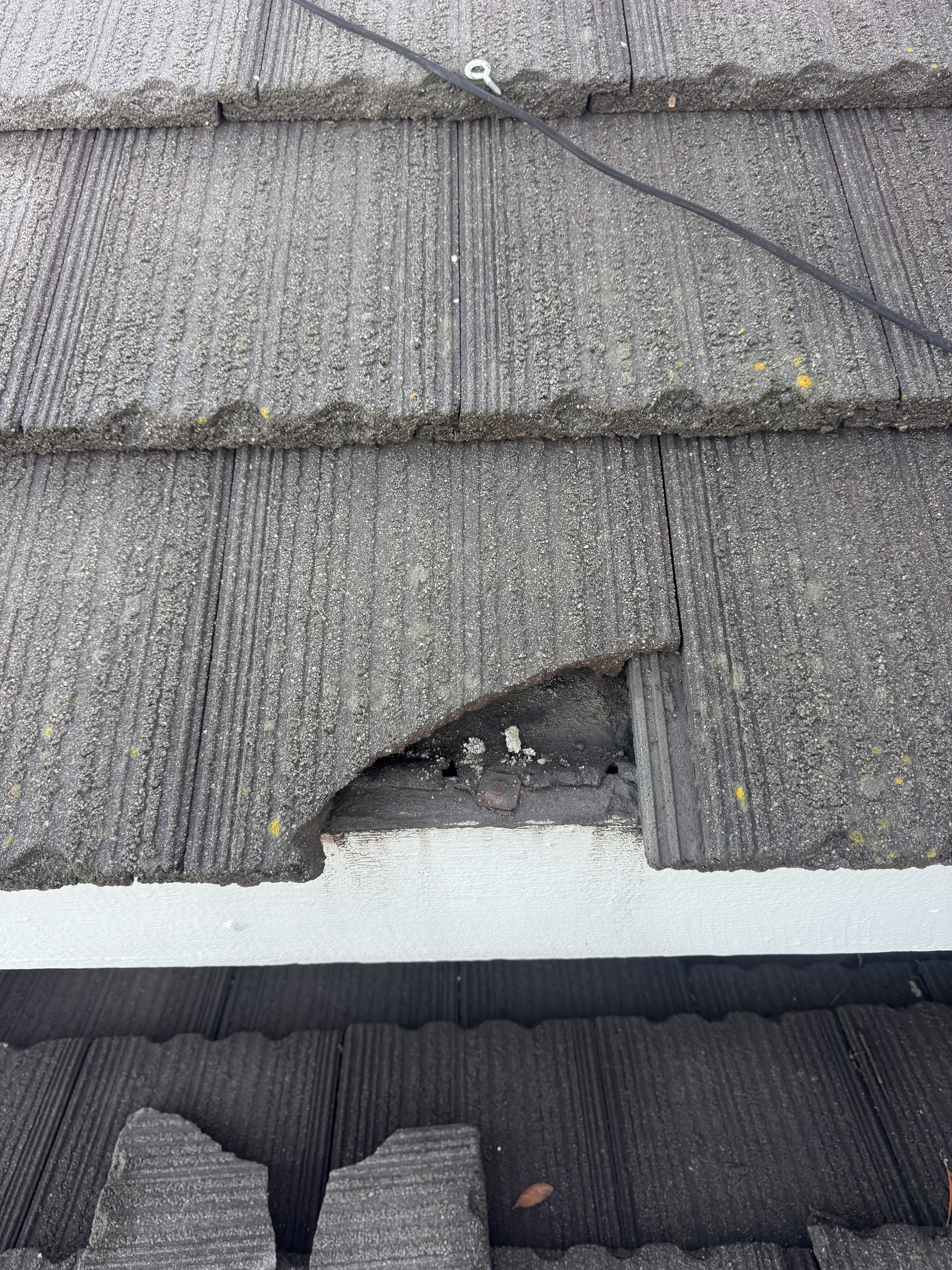 Broken roof tiles and flashing
